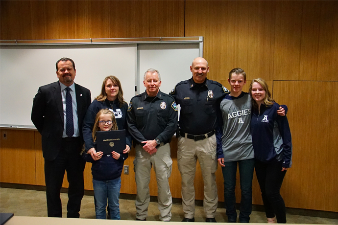 Andy'sfamily with Dean White and members of the USU police force