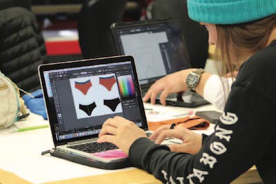 Jacee Andersen works on her swimsuit design concepts