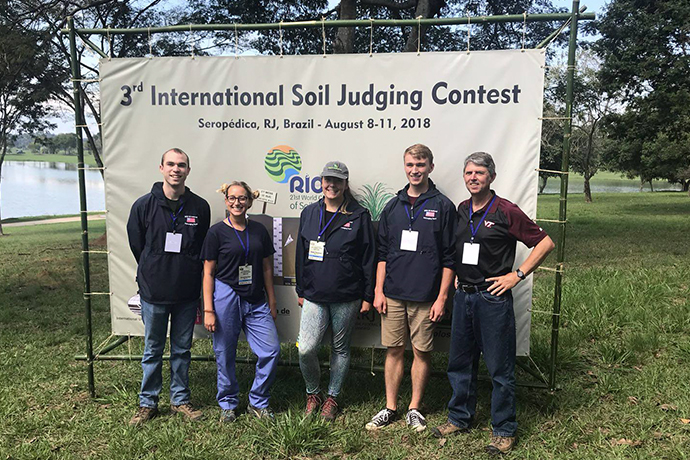 Soil Team USA members--Braden Povah (Cal-Poly), Anna Scott (Clemson university), Emma Thompson (Utah State), Ben Smith (Virginia tech), and our coach Dr. John Galbraith (virginia tech)