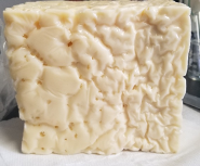 picture of unusual swiss cheese Swiss cheese with irregular eye formation. Photo provided by Campfied
